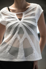 Woman wearing organic cotton and bamboo tee with mesh butterfly pattern design