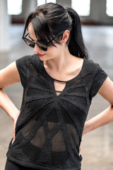 Woman wearing organic cotton and bamboo tee with mesh butterfly pattern design