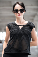 Woman wearing organic cotton and bamboo tee with mesh butterfly pattern design