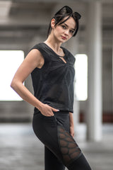 Woman wearing organic cotton and bamboo tee with mesh butterfly pattern design