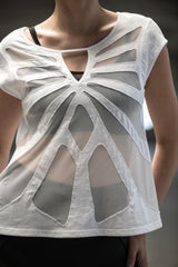 Woman wearing organic cotton and bamboo tee with mesh butterfly pattern design
